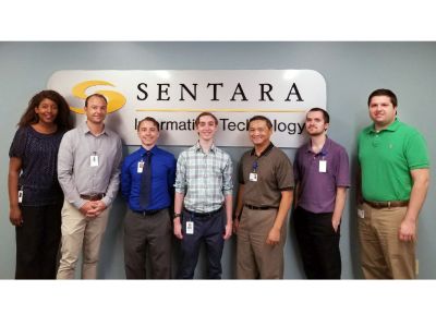 Sentara's Junior Cyber Security Analysts hired through CSIIP and their mentors are all smiles for this photo opportunity!